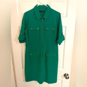 Gorgeous zip-up green dress with pockets and good accents. Very flattering!